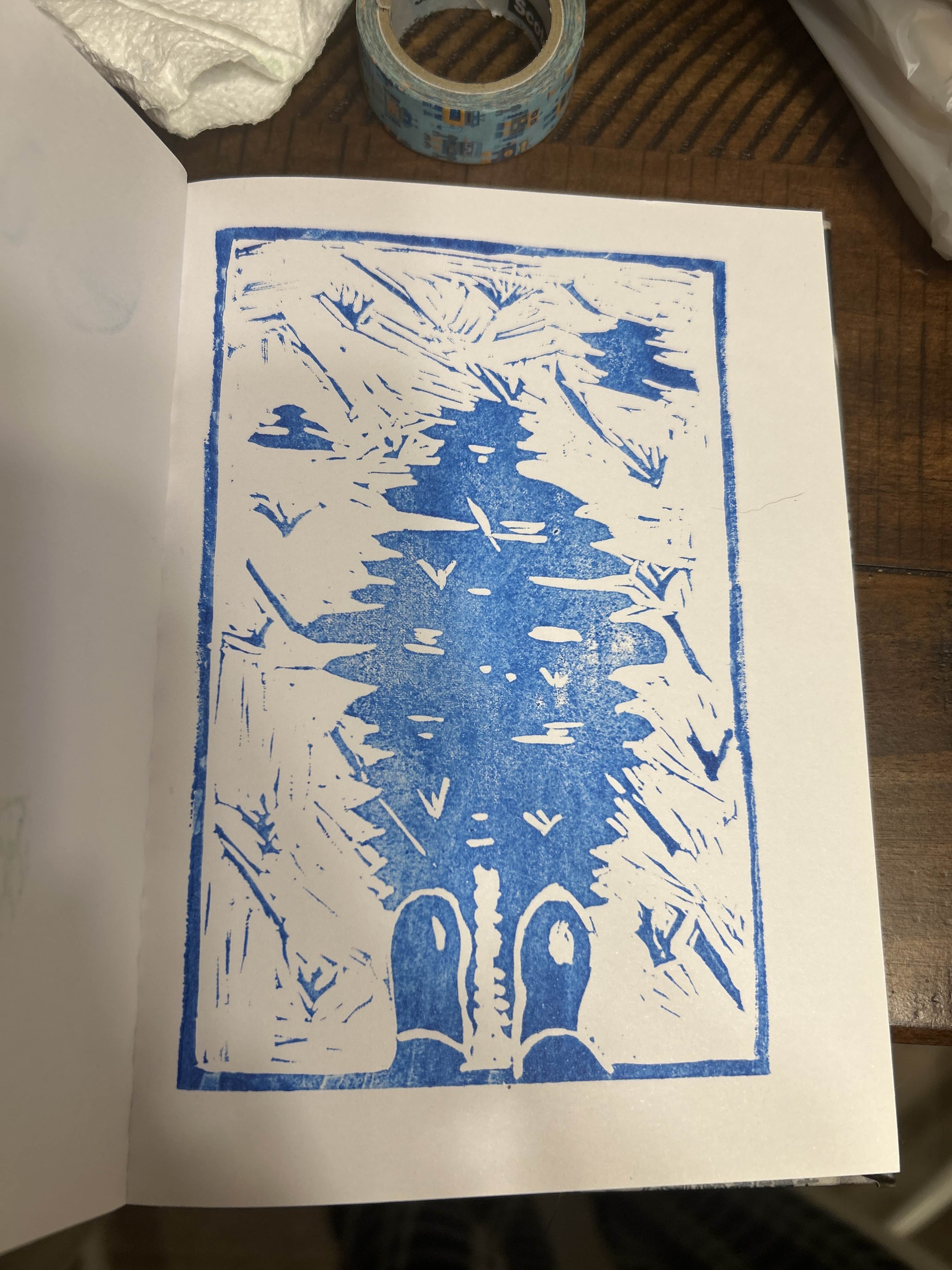 blue ink print of a squiggly reflection of a person in a puddle